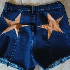 Cute jean shorts with stars on pockets. Western style. Size medium, never worn.